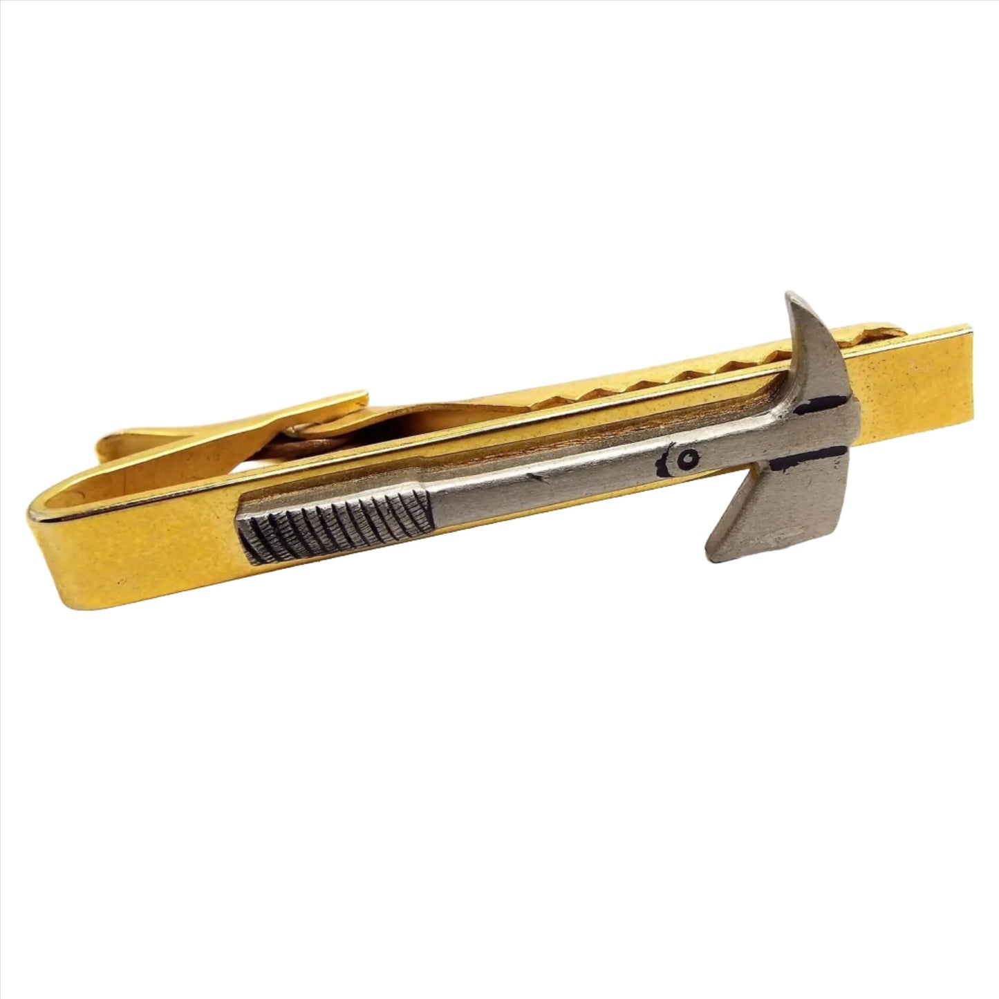Front view of the retro vintage fireman's hatchet Prandi axe tie clip. The tie clip part is gold tone in color. The axe on the front is a light pewter gray.