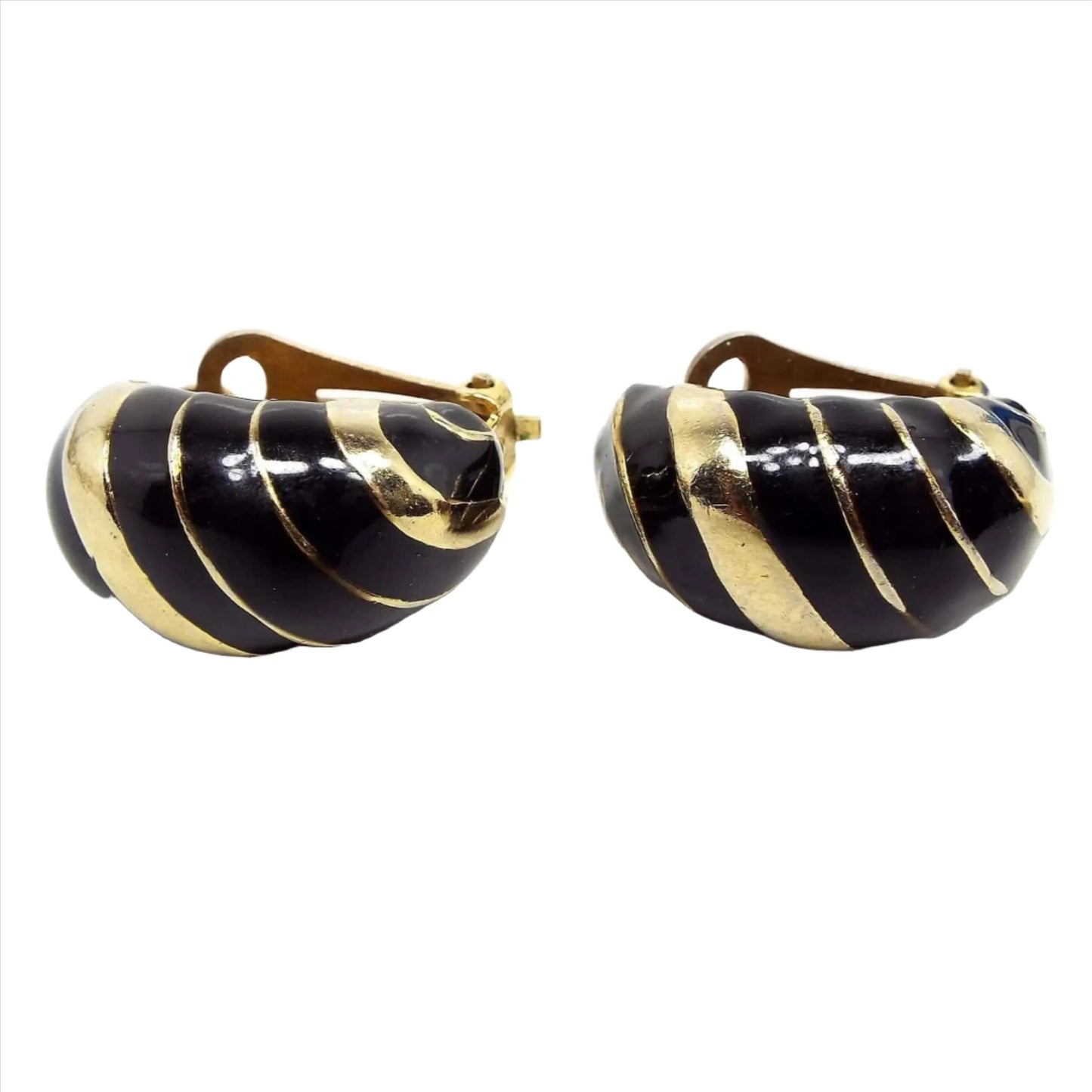 Front view of the retro vintage enameled half hoop earrings. The metal is gold tone in color. There are diagonal bands of enamel and metal.