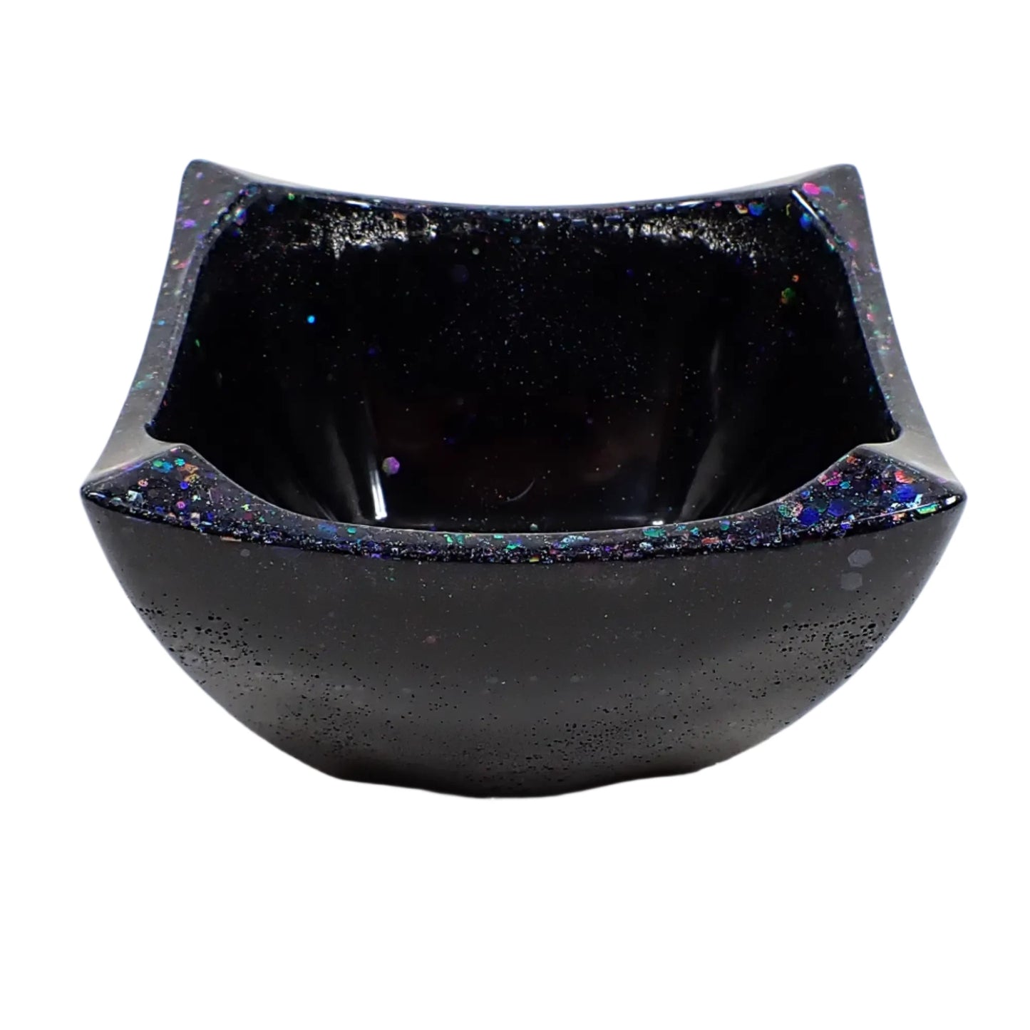 Angled view of the bowl, Sparkles of glitter can be seen around the top edge.