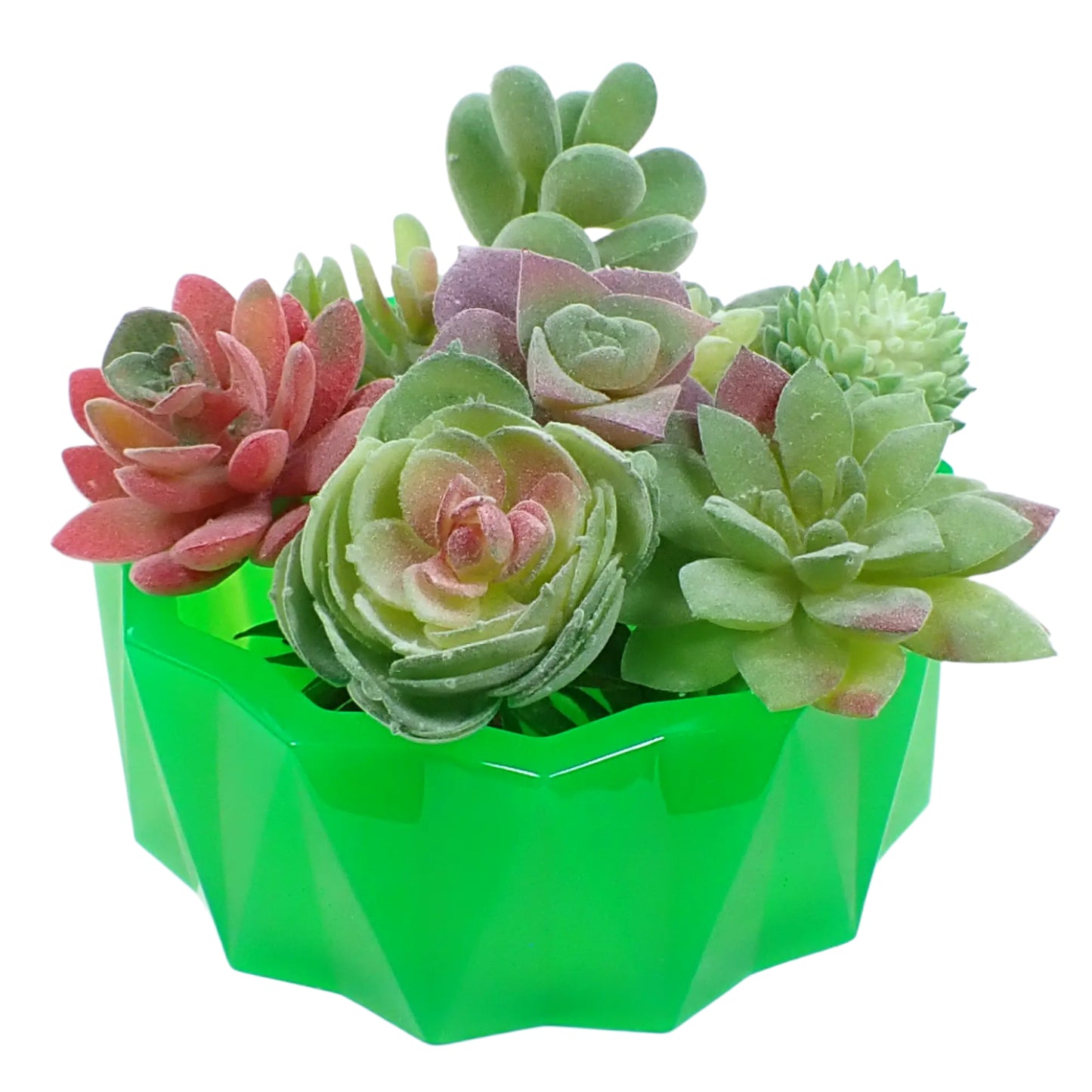 Image of the large handmade neon green faceted bowl with a bunch of display fake succulents in it to show how it would look as a planter pot.