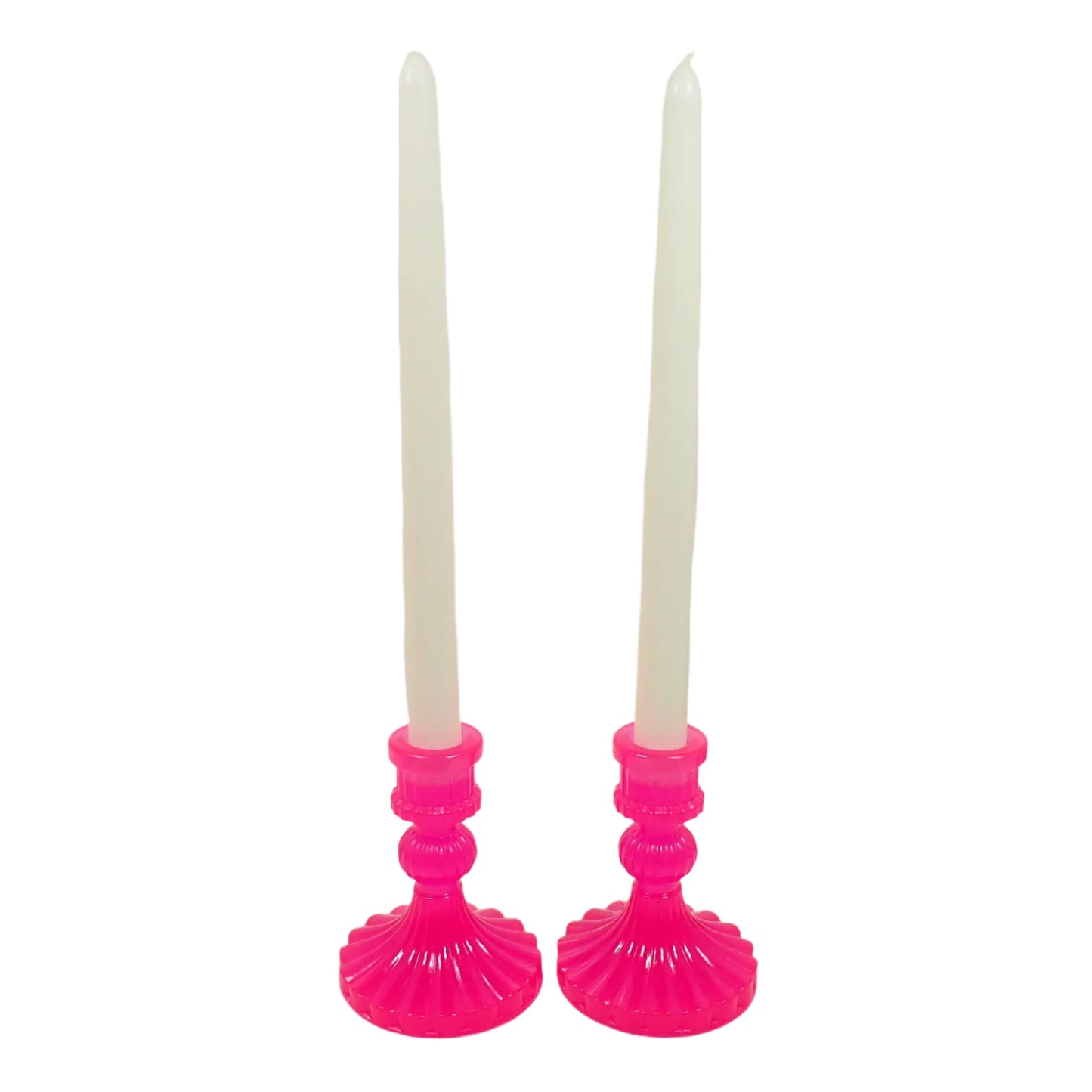Image of the set of two handmade neon pink candle holders with off white taper display candlesticks in them to show how they would look with the candles.