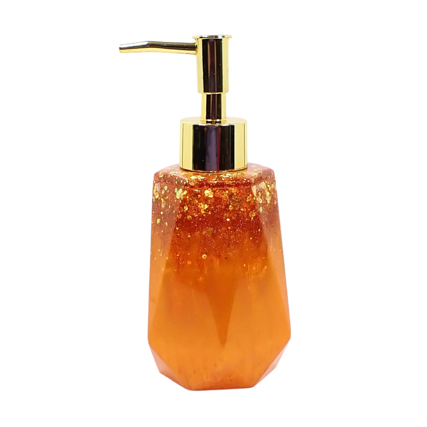 Side view of the handmade resin soap dispenser. This photo shows it with a gold color pump on top. The bottle part has pearly bright orange resin on the bottom and chunky iridescent orange glitter on top. It has a faceted shape with a flared out bottom.