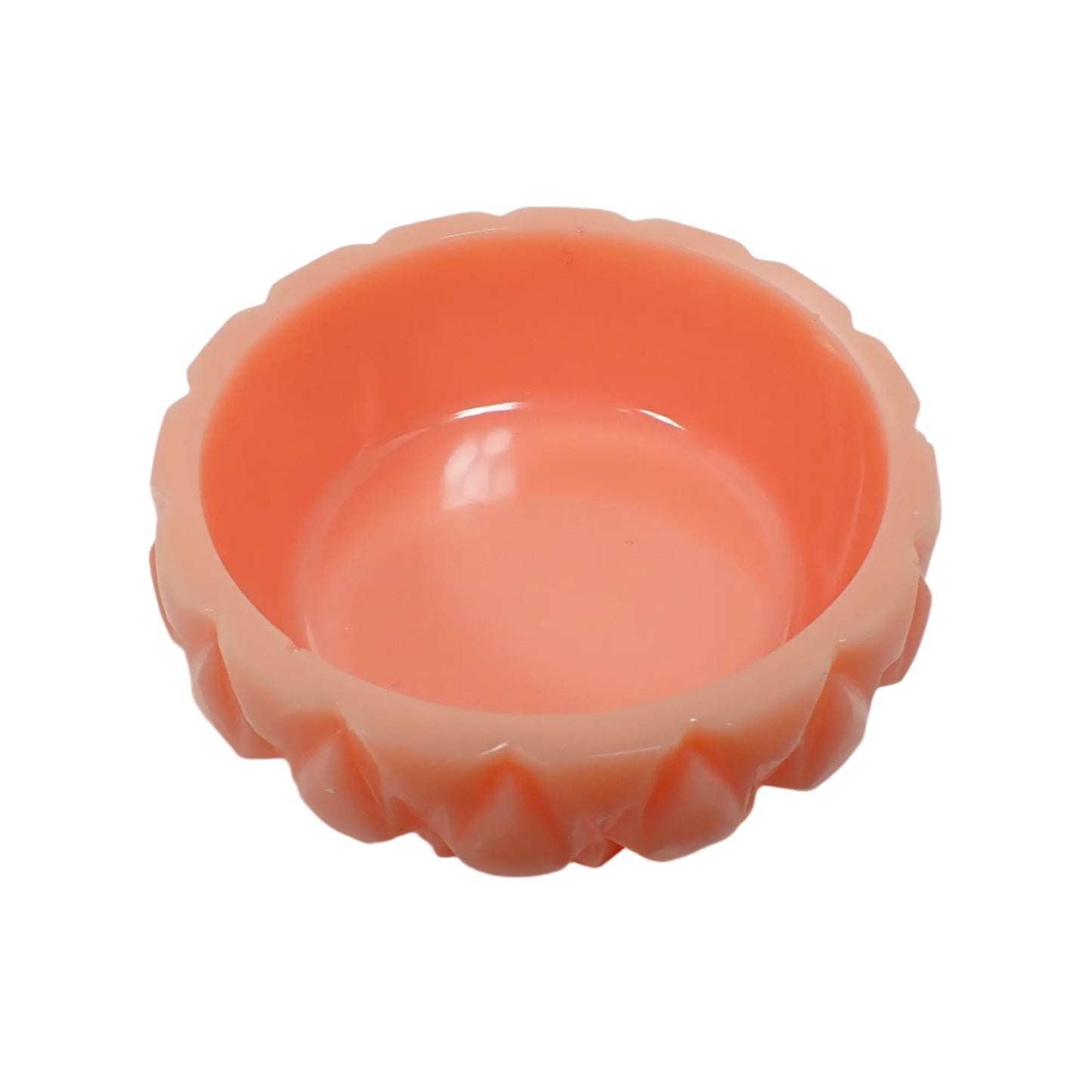 Angled top view of the handmade pastel peach resin ring dish showing the inside area where rings or other small items could be placed.