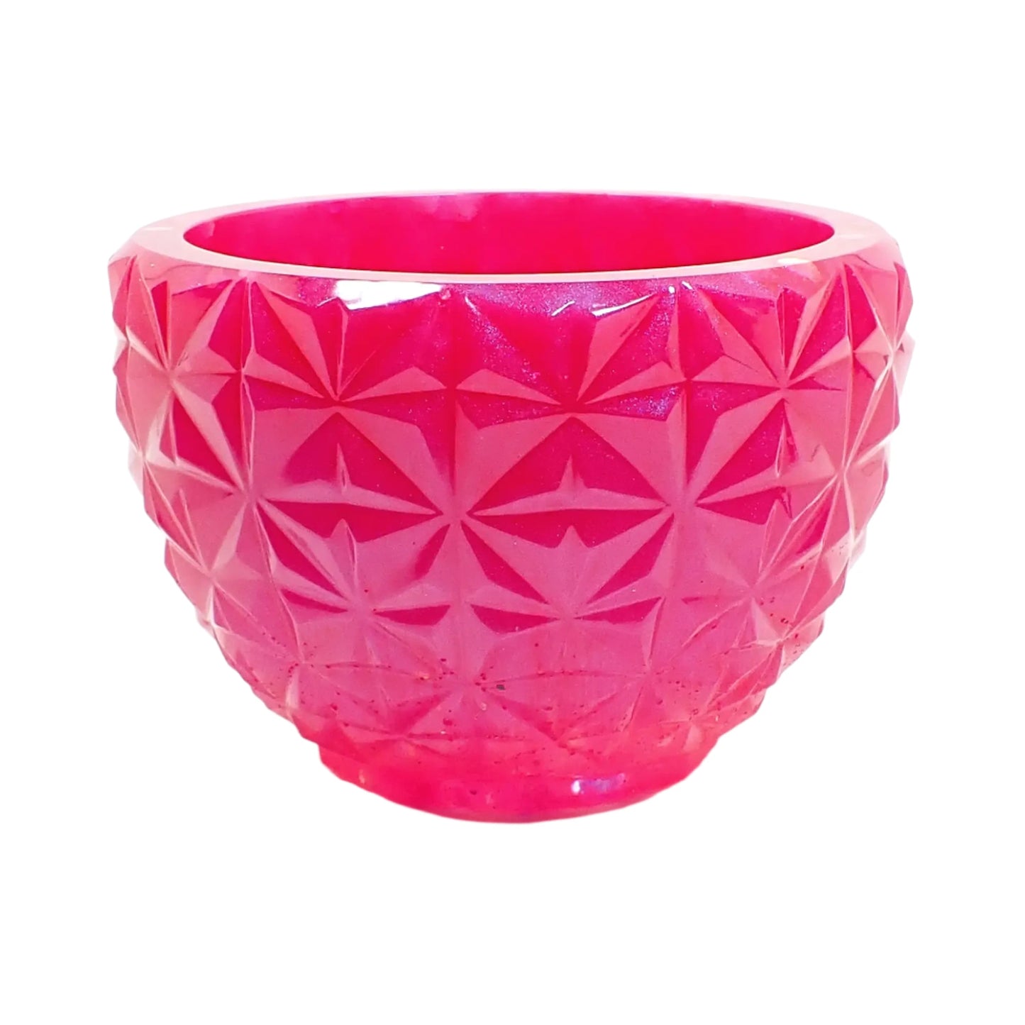 Side view of the bowl showing the retro style faceted design. It looks like square areas with carved star like shapes.