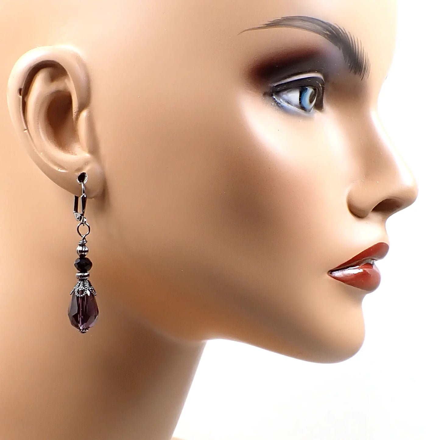 Photo of one of the earrings on a mannequin to show how they would look when worn and to give an idea of size.