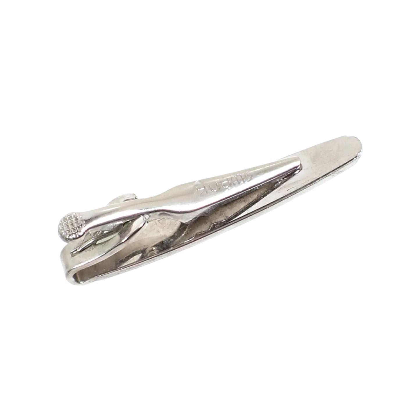 Back view of the Swank vintage starburst tie clip showing the clip and the Swank marking.