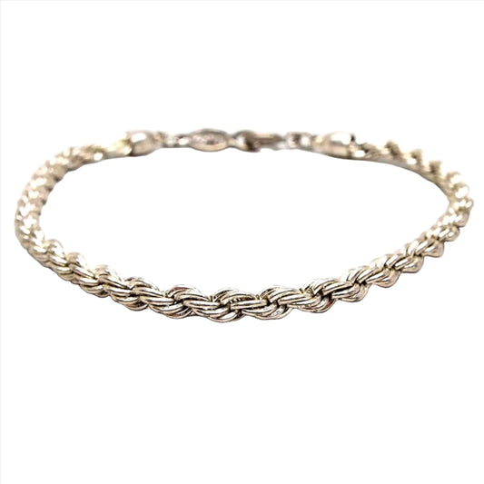 Front view of the retro vintage Napier chain bracelet. It is silver tone in color and has a twisted rope chain design.