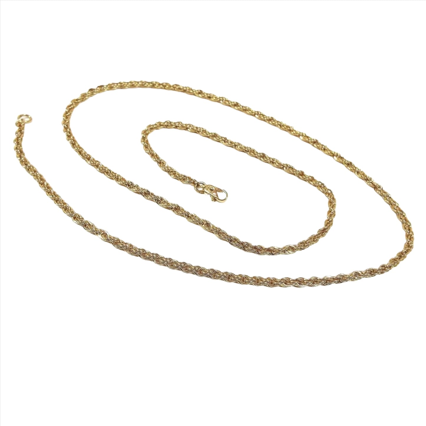Top view of the retro vintage chain necklace. The metal is gold tone in color. It has a rope chain design with a small lobster claw clasp on the end.