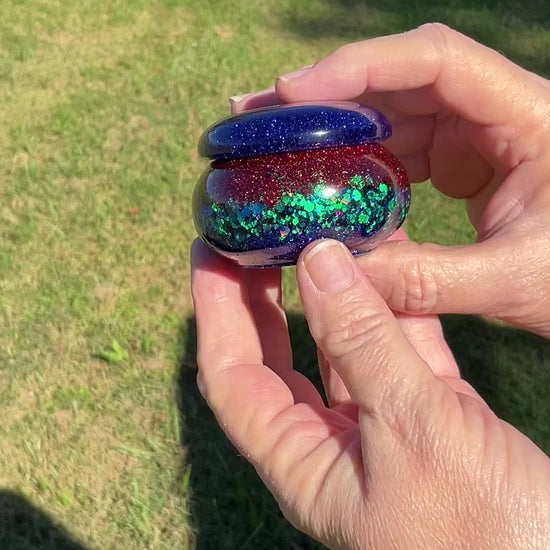 Small Blue Red and Green Resin Handmade Round Trinket Box with Iridescent Glitter video showing how the glitter sparkles in the light.