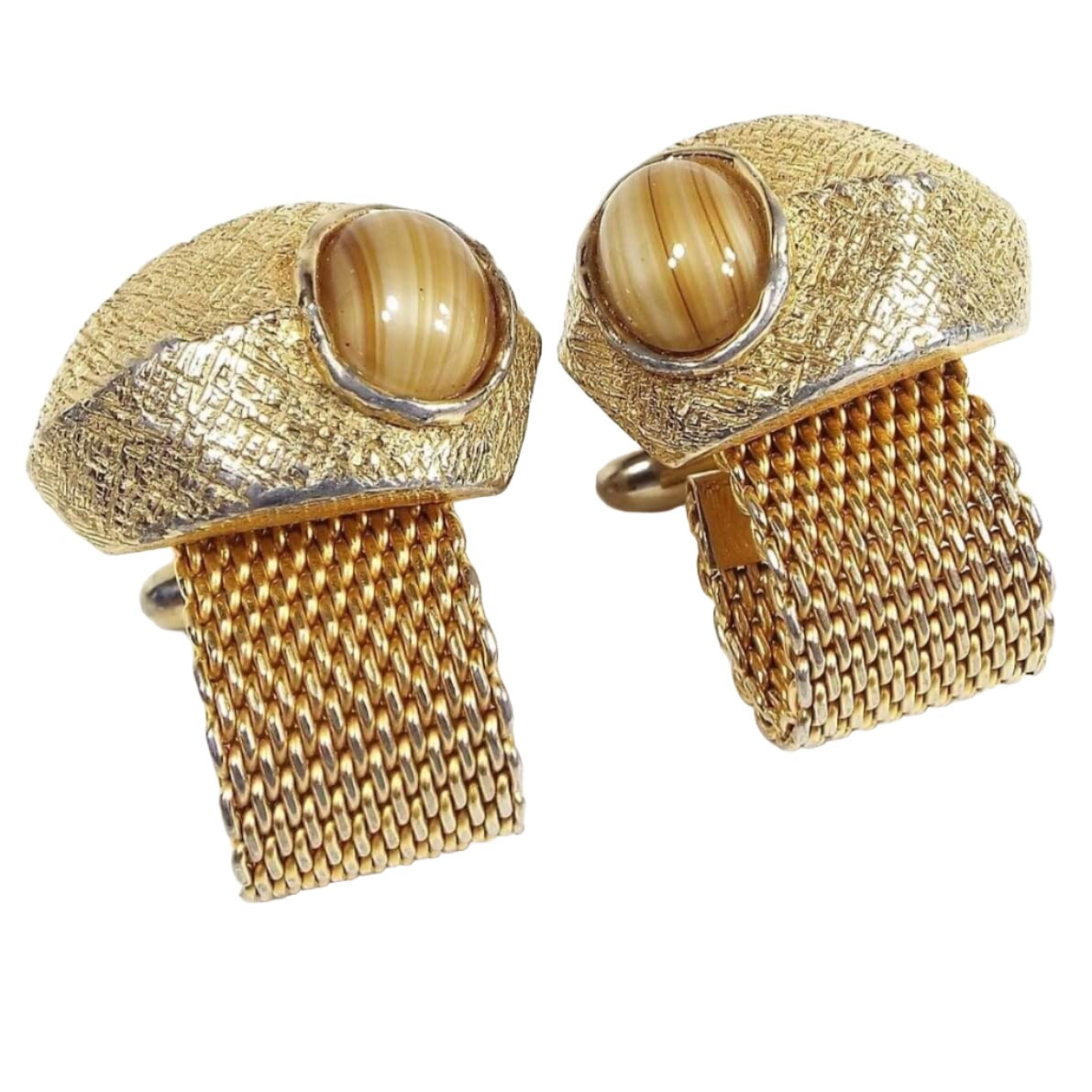 Front view of the Mid Century vintage mesh wrap around cufflinks. The metal is gold tone in color. The tops have a free form style shape with domed round fancy glass cabs. The glass has striped shades of brown, yellow, and cream colors.