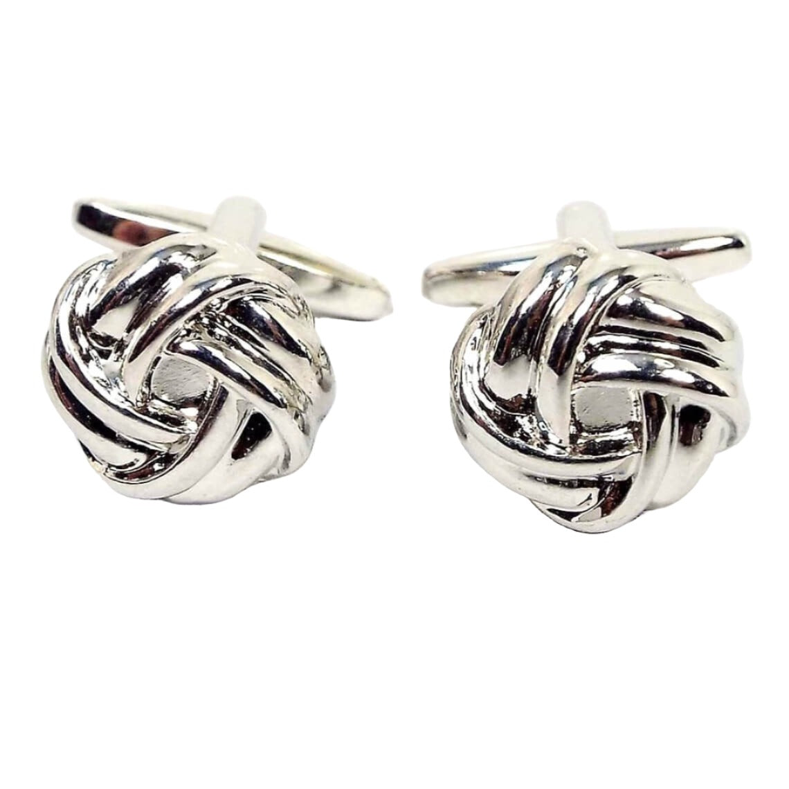 Front view of the retro vintage knot cufflinks. They are silver tone in color with a knot design.