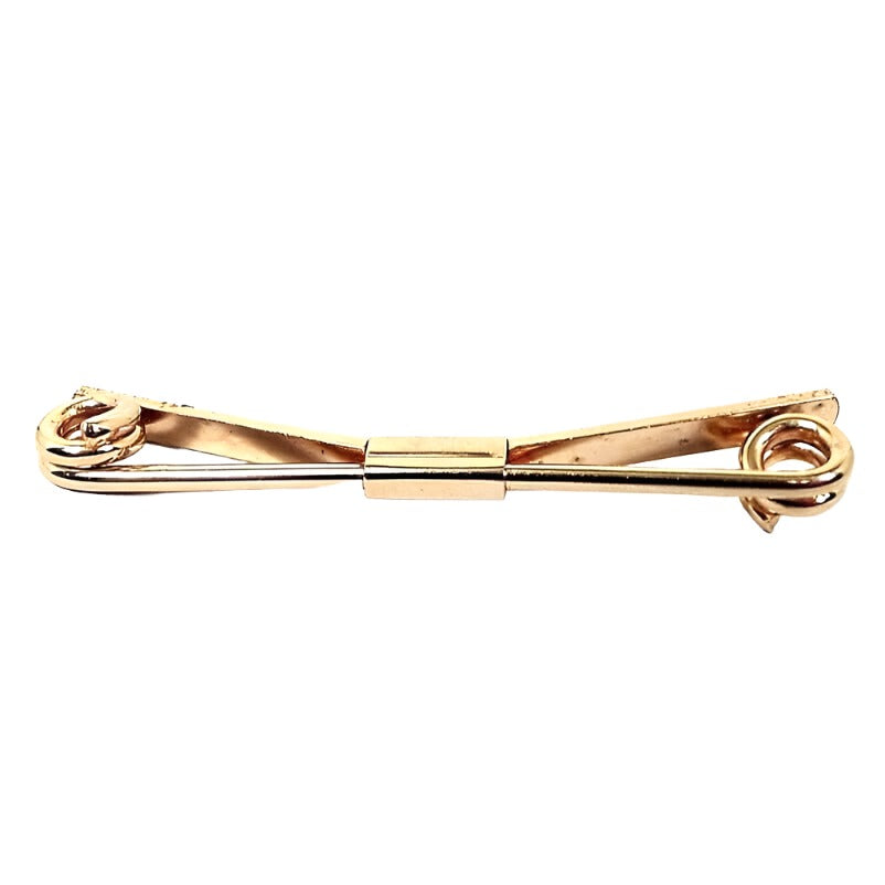 Front view of the Anson Mid Century vintage collar clip. It is gold tone in color. The front has a thick wire bar thas is spiral at the ends. the back is a flat wider bar that is angled. there is a rectangle holding both bars together in the middle.