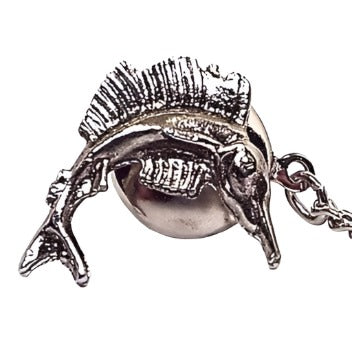 Front view of the retro vintage sailfish tie tack. The metal is darkened silver tone in color. The front has a marlin fish shape with textured fins. The back clutch has a chain with a small bar on the end.