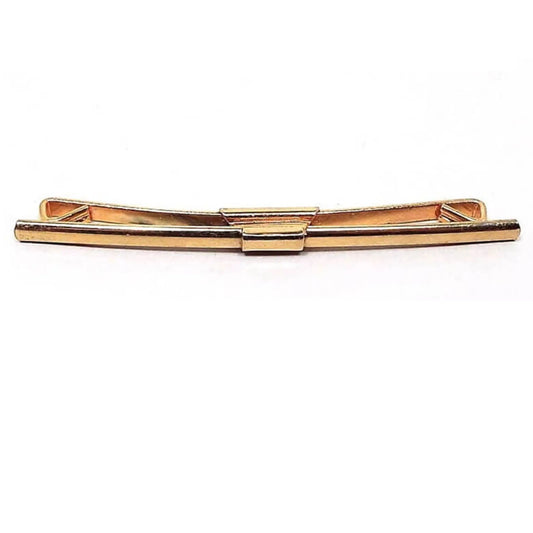 Front view of the 1940's long vintage collar clip. It is gold tone in color with a slightly curved bar on the front.