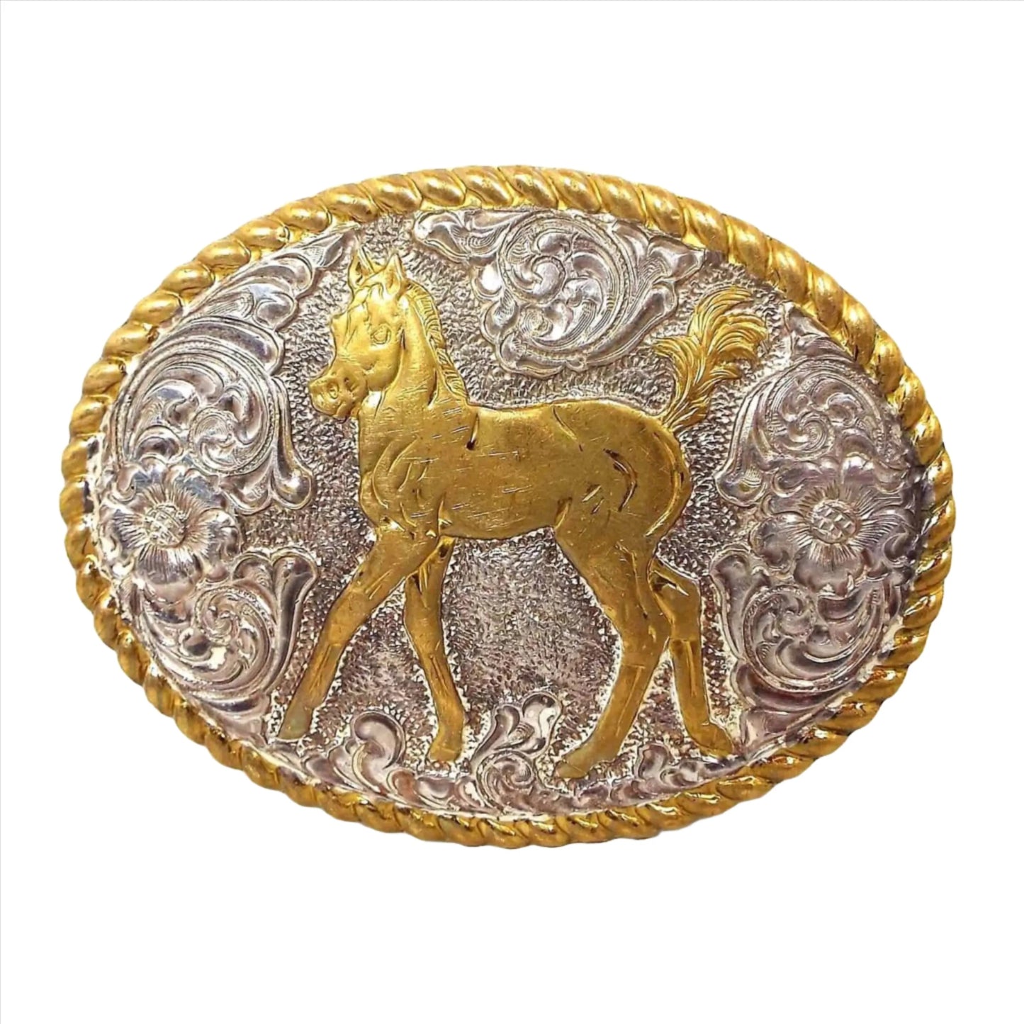 Front view of the retro vintage Crumrine horse belt buckle. It is silver tone in color with a bronze twisted rope design edge and pony on the front. The rest of the buckle has a floral design.