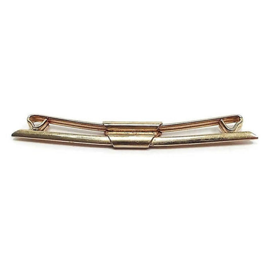 Side view of the 1930's Art Deco Swank vintage collar clip. It is gold tone in color and has angled front and tapered ends.