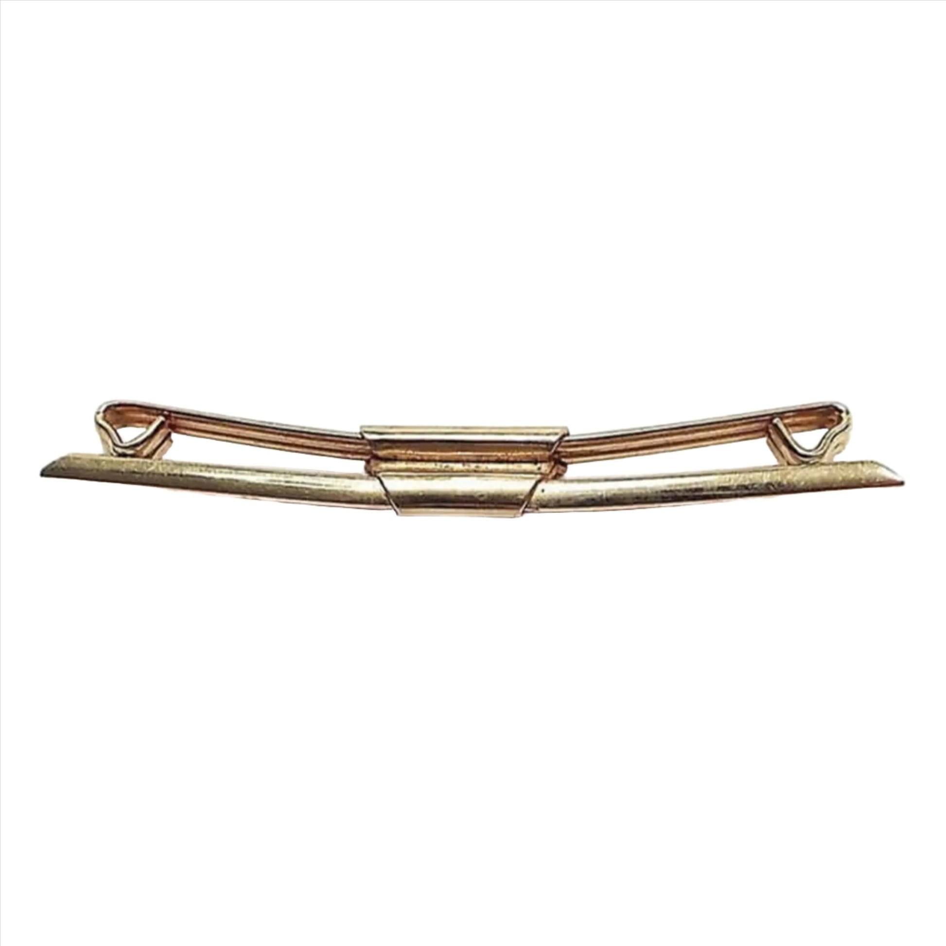 Side view of the 1930's Art Deco Swank vintage collar clip. It is gold tone in color and has angled front and tapered ends.