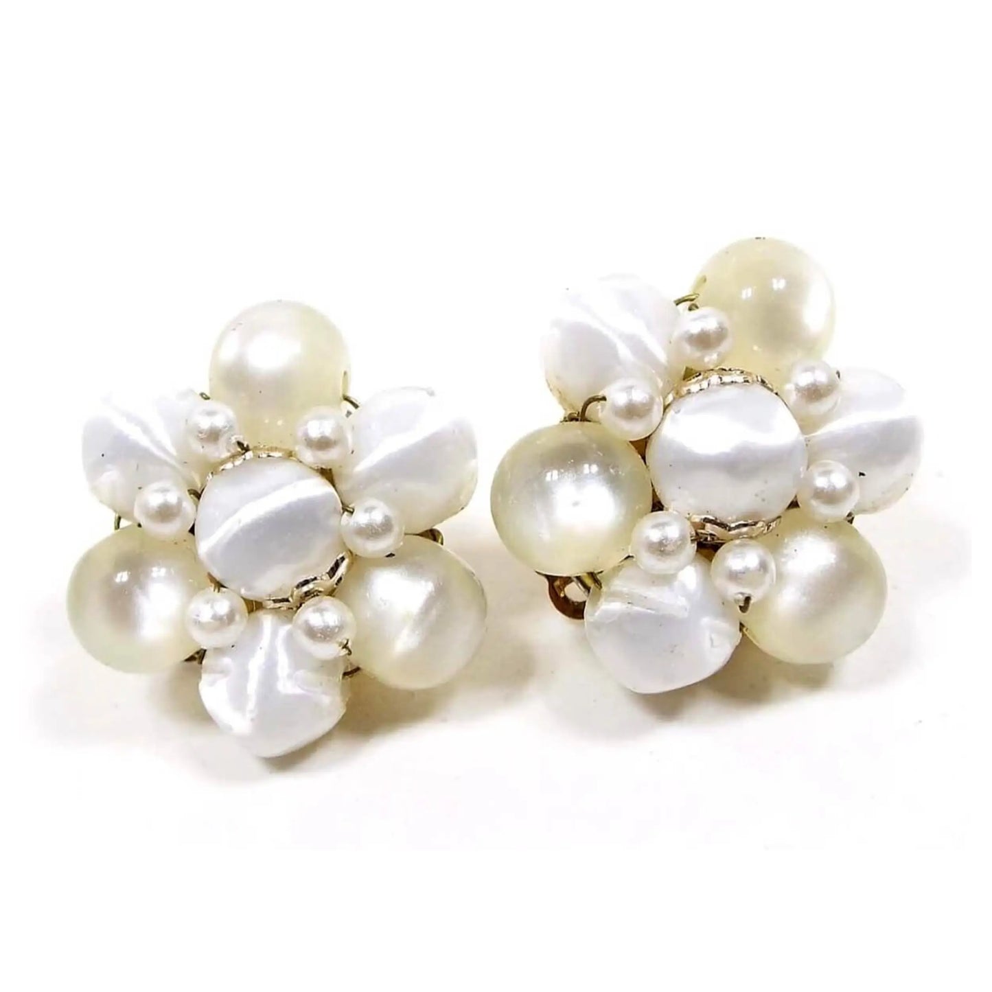 Front view of the Mid Century vintage beaded earrings from Japan. It has pearly white plastic chunky beads and off white moonglow lucite round beads.