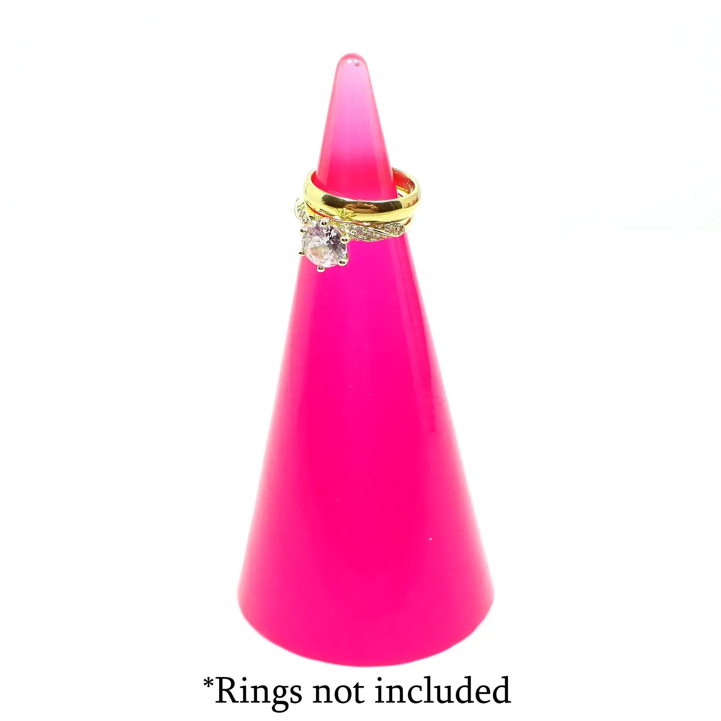 Photo showing the ring holder with rings sitting around the top. There is wording at the bottom that says "Rings not included."