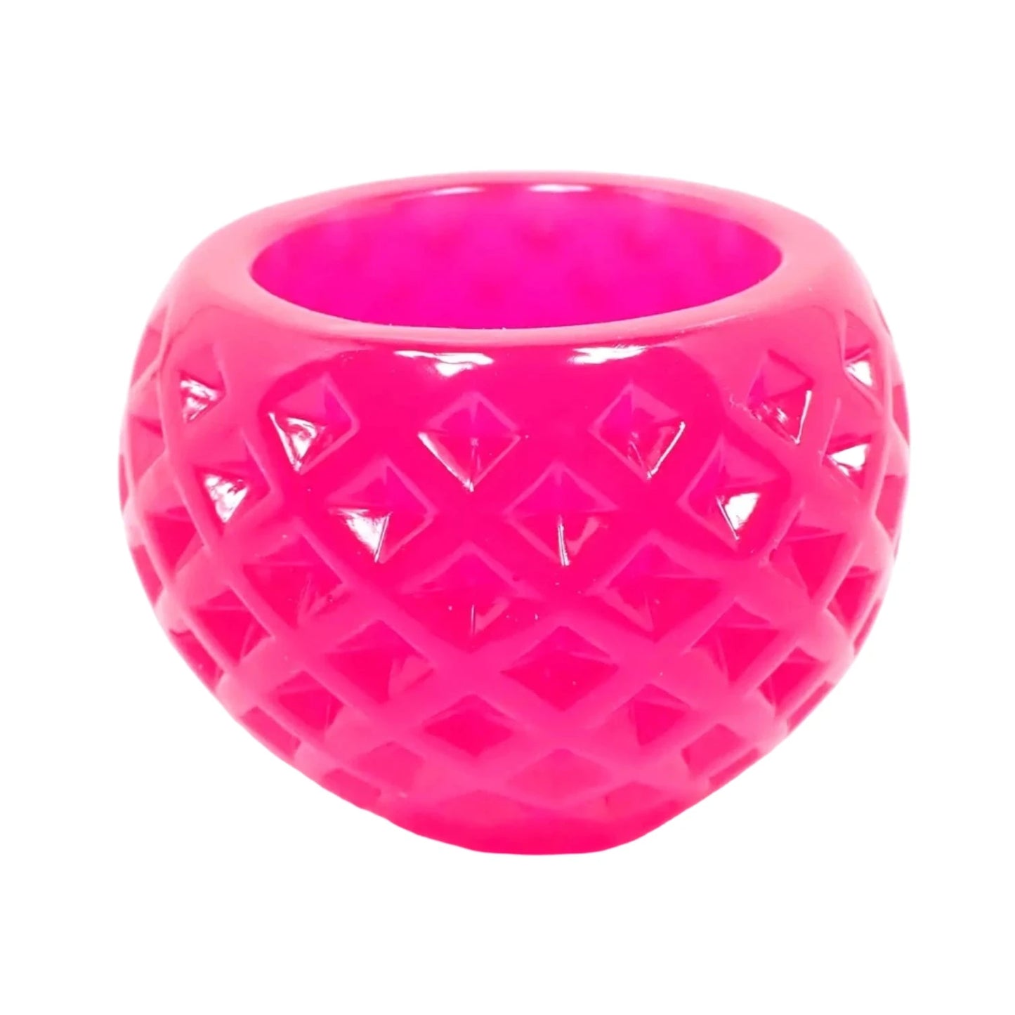 Side view of the small round handmade resin succulent pot. The resin is bright neon pink in color. There is a diamond shaped indented pattern all the way around it. The top has a round opening for tiny plants or small trinkets.