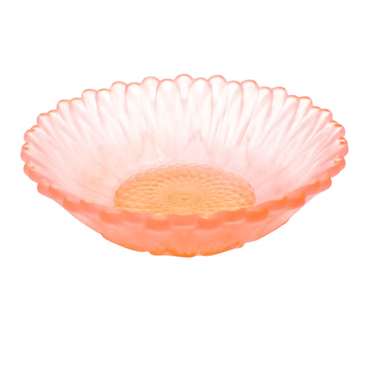 Side view of the small handmade sunflower resin trinket dish decorative bowl. The piece is frosted translucent resin with shades of light pink on the petals and peach in the middle of the flower.