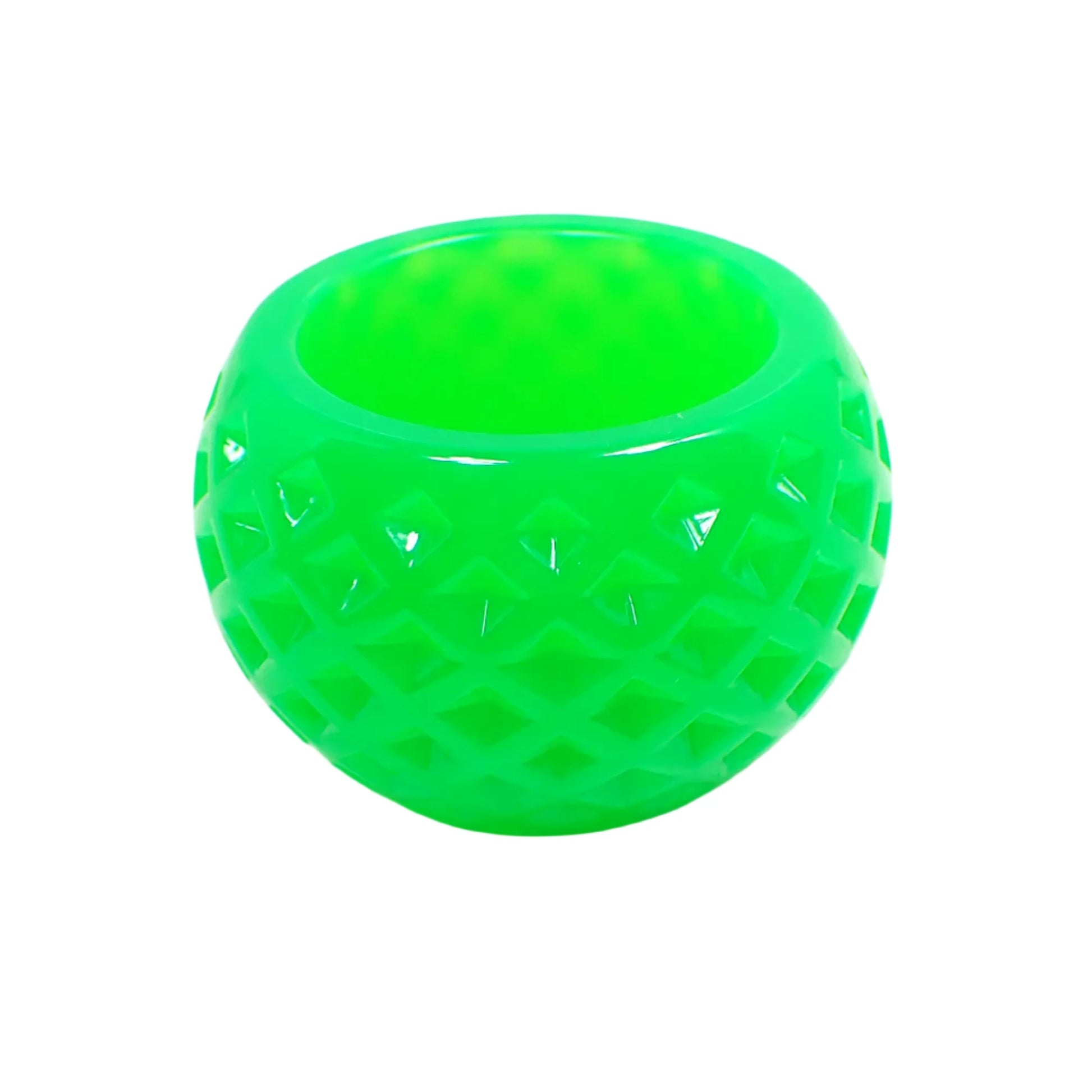 Side view of the handmade small decorative bowl. It has a rounded shape with an indented diamond pattern design. The color is a bright neon green. 