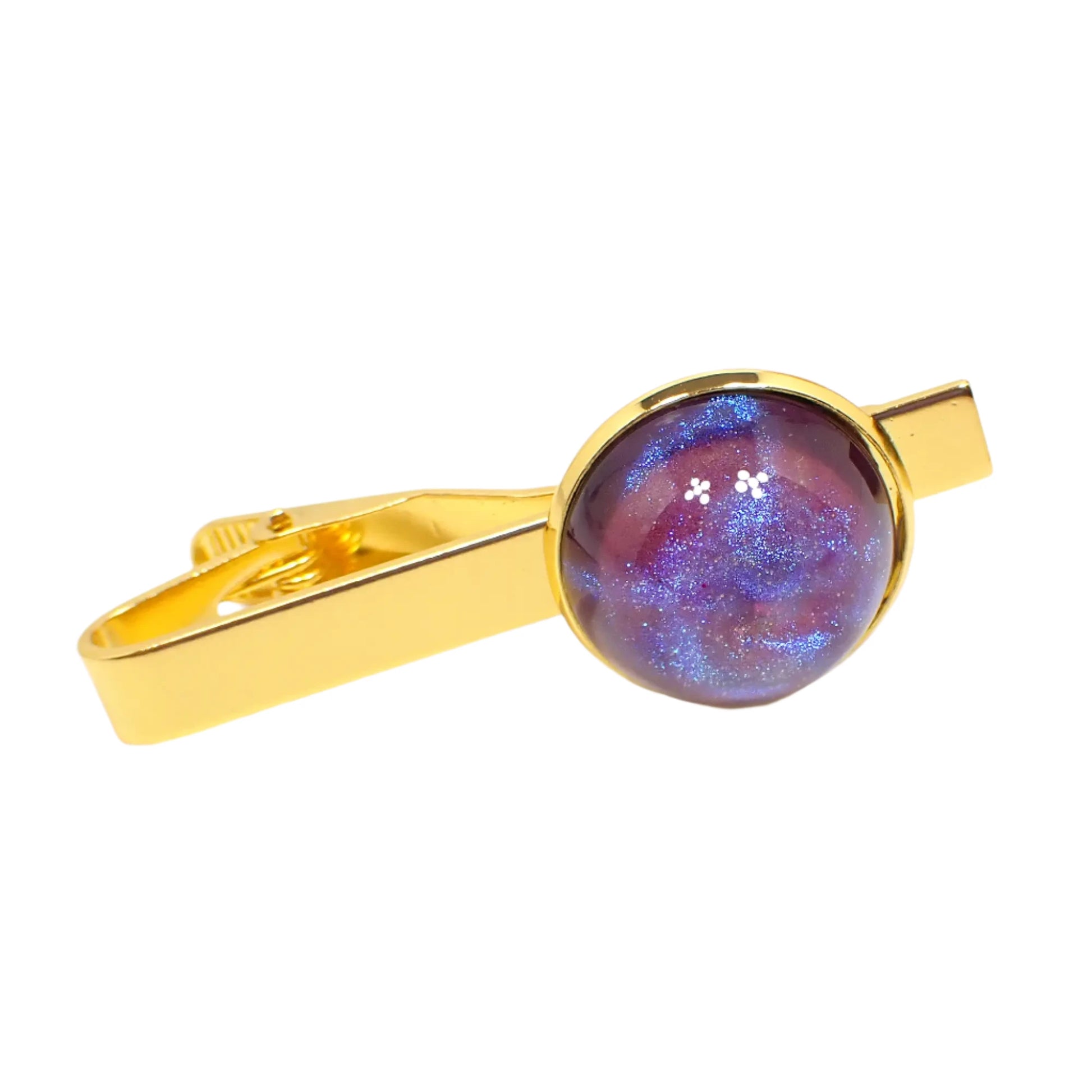 Front view of the handmade tie clip. The metal is gold tone in color. There is a domed round resin cab at the end that has iridescent pink with swirls of blue and shifts to some purple as the light hits it.