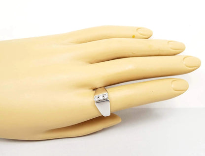 Photo of the ring on a mannequin hand showing how it would look when worn.