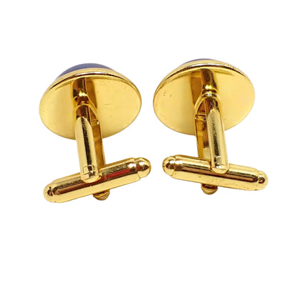 Photo of the back of the cufflinks. The metal is gold tone in color and they have bullet back style levers.