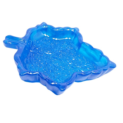 Another angled photo of the blue leaf trinket dish showing how deep the inside area is to hold things.