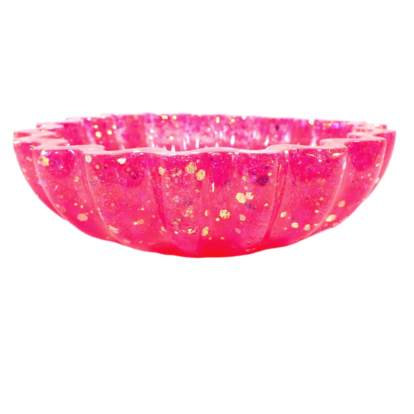 Side view of the handmade scalloped resin bowl. Here more of the glitter sparkle can be seen and that the scalloped design goes around the entire outside of the bowl.