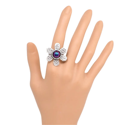 Photo of the color shift flower ring on a mannequin hand to give an idea of its size and how it would look while being worn.