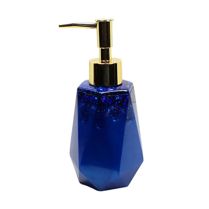 Another side view of the handmade soap dispenser showing how the dark ocean blue and iridescent glitter meet towards the top.