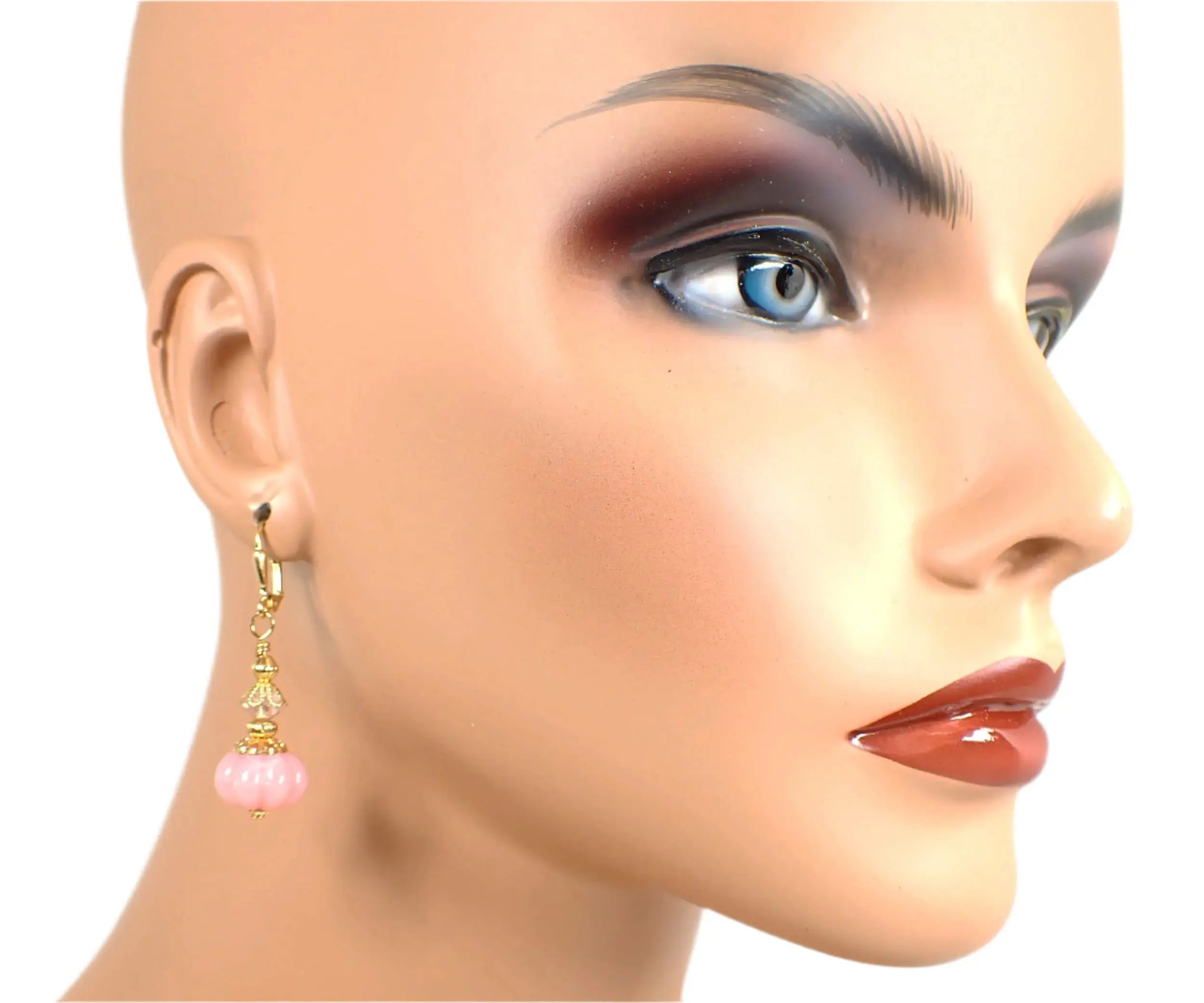 Earring on a mannequin showing how the earrings would look when worn.