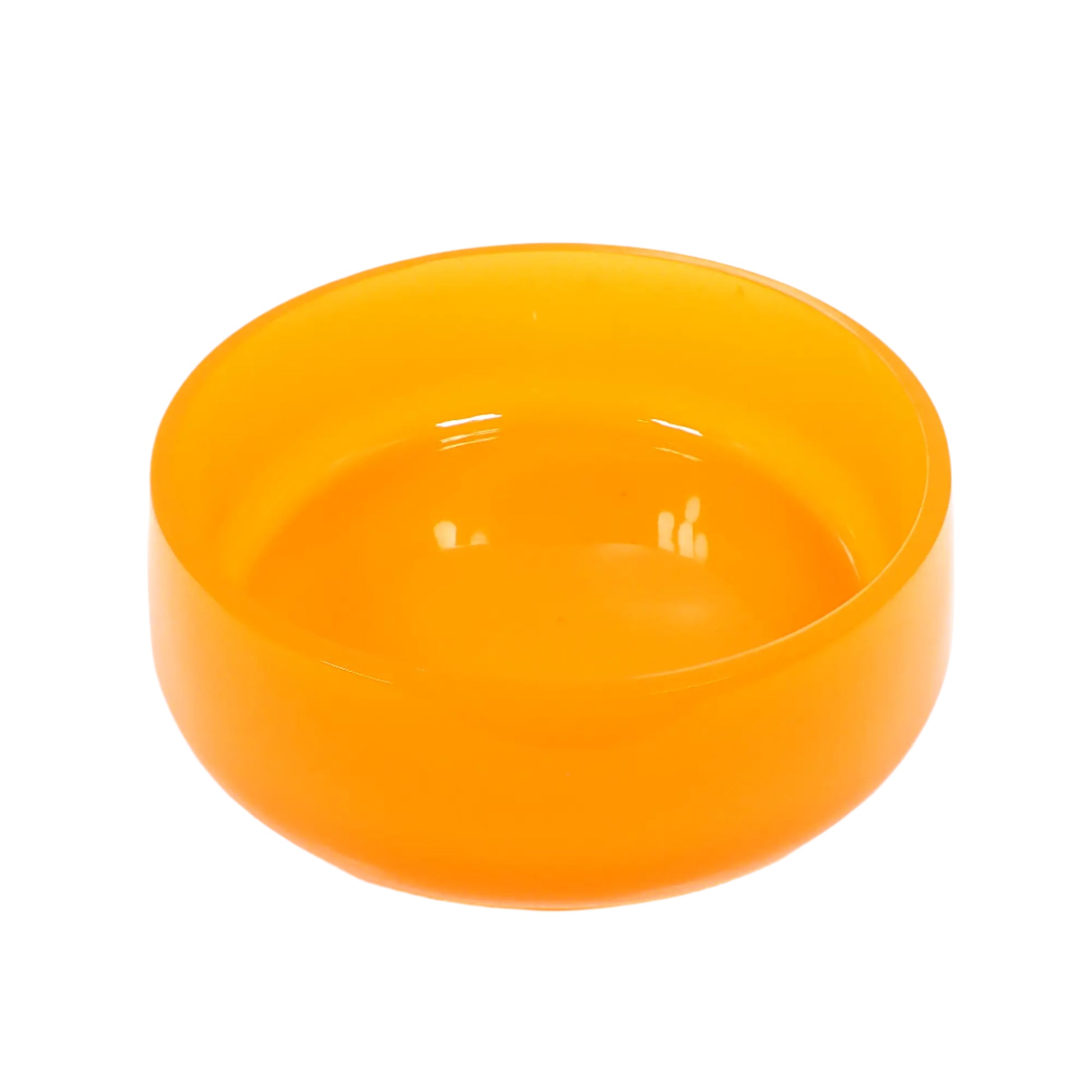 Angled view of the handmade neon orange resin decorative bowl. It is large and round with a slightly flared bottom. The resin is shiny and semi translucent in a bright neon orange color.