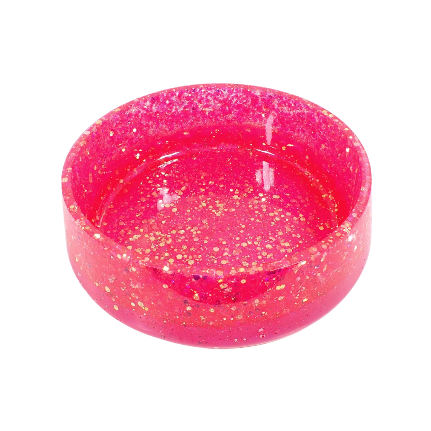 Angled view of the large handmade resin bowl. Here more of the inside area can be seen where items can be placed. The glitter has flashes of sparkle showing in the photo.