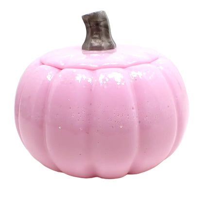 Side view of the pumpkin trinket box. The light pink color has some specks of the iridescent glitter throughout.