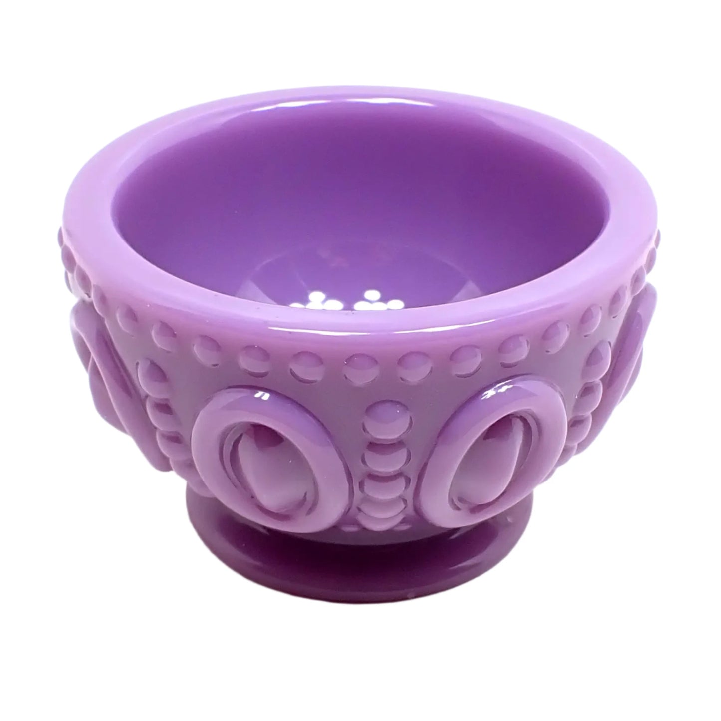 Another angled side view of the light purple footed bowl. Here the bottom round footed part can be seen as well as the top opening.