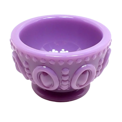 Another angled side view of the light purple footed bowl. Here the bottom round footed part can be seen as well as the top opening.