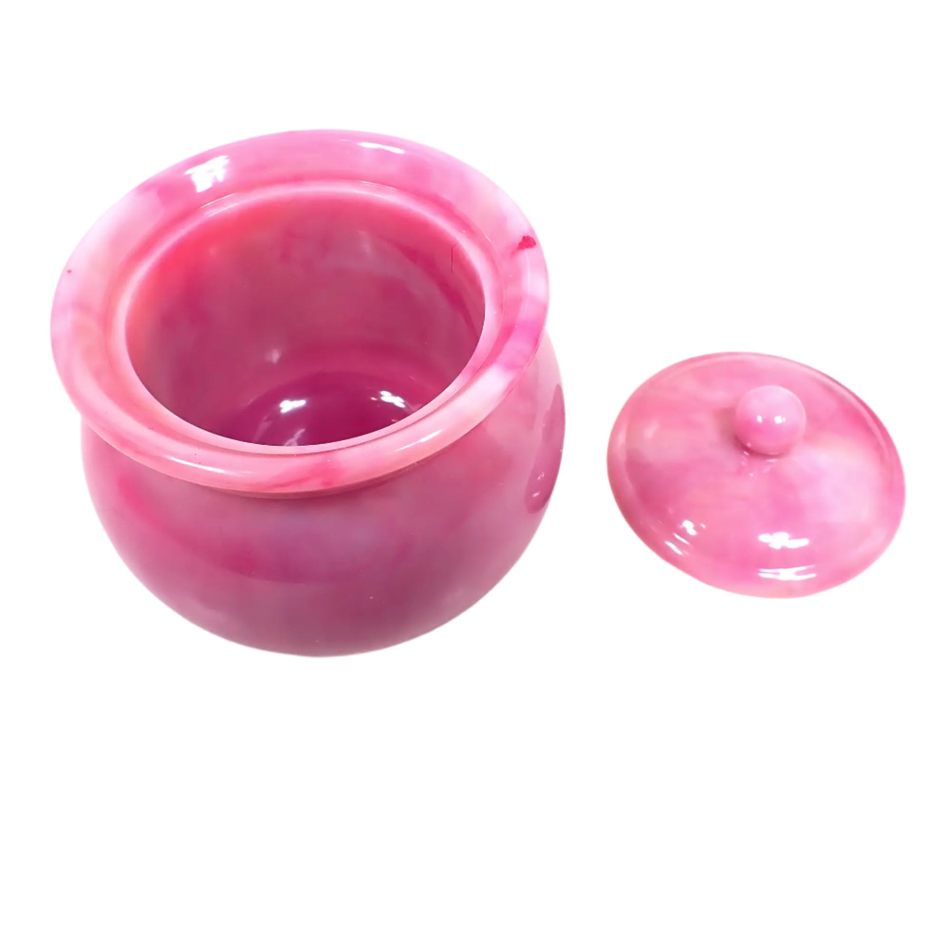 Angled top view of the handmade marbled pink resin decorative jar with the lid off showing the inside area where small items could be placed. The inside is shiny and smooth.