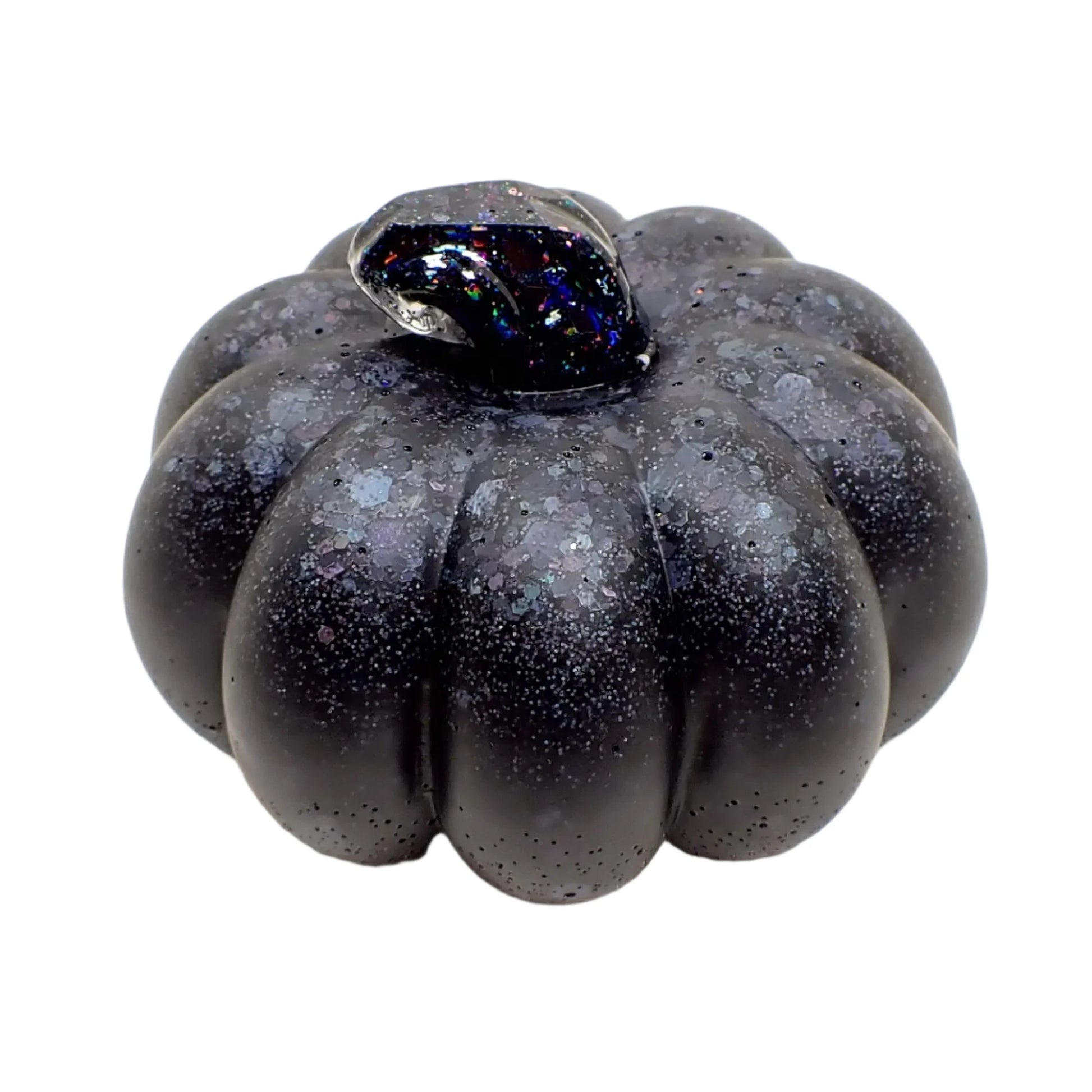 Angled view of the matte black pumpkin showing more of the top area where the soft colors of the glitter shows through.