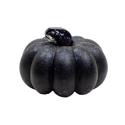 Another side view of the matte black glitter resin pumpkin. You can see the colorful flashes of color in the shiny stem area.