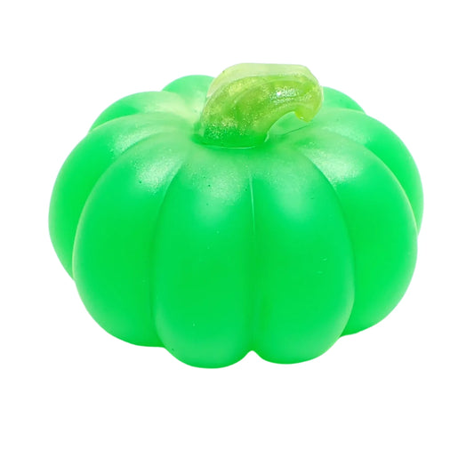 Angled side view of the small pumpkin decor. It has pearly green at the stem and matte neon green resin for the rest of the pumpkin.