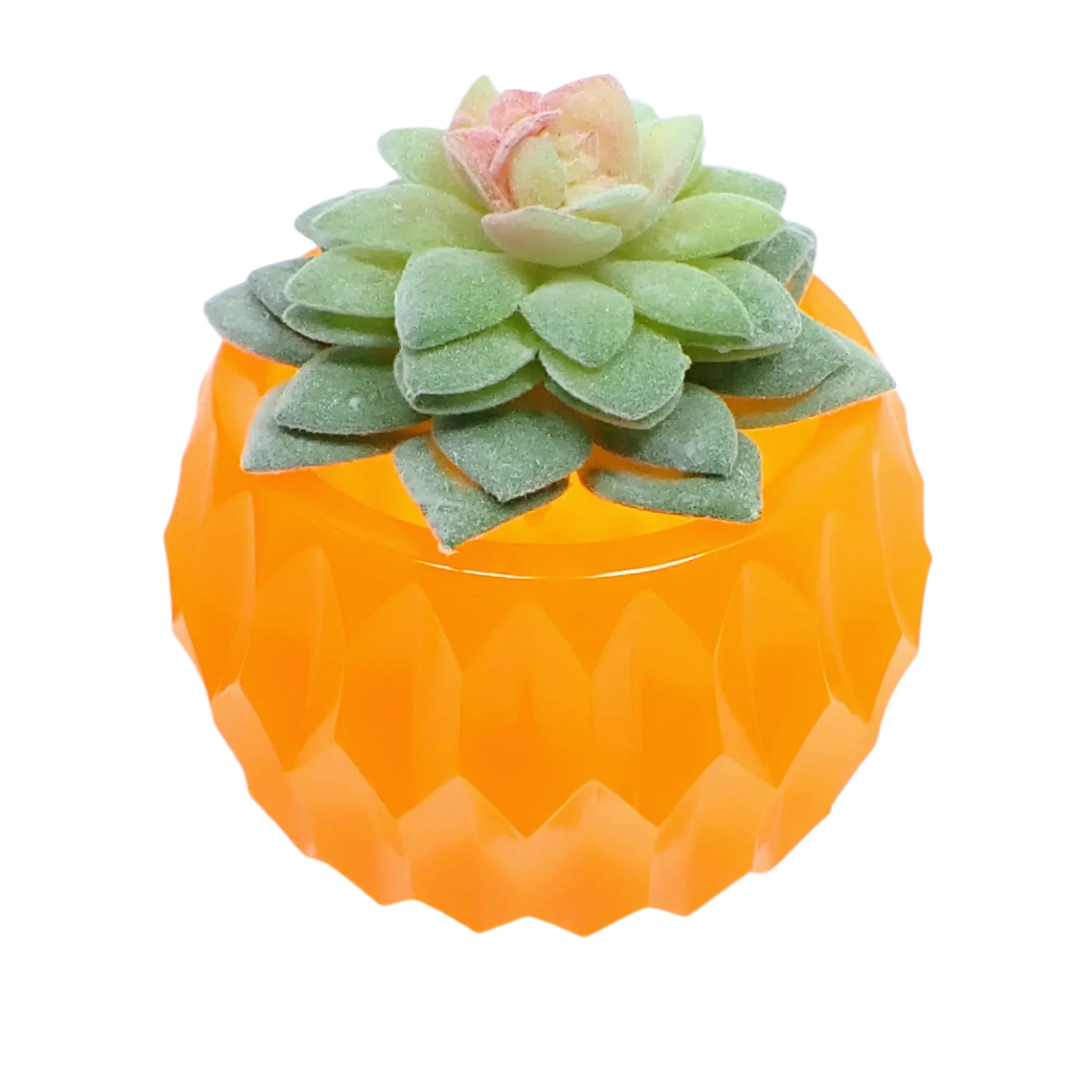 Photo of the handmade neon orange bowl with hexagon pattern holding a fake succulent plant. 