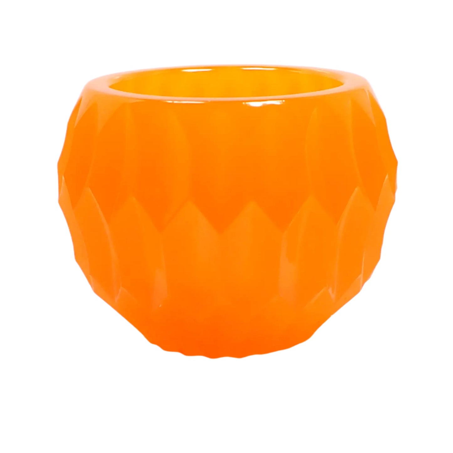 Side view of the neon orange bowl showing more of the indented hexagon design that goes around the bowl.