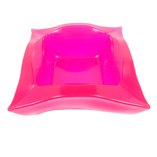 Angled top view of the handmade resin retro atomic style square decorative bowl. The resin is semi translucent and shiny in a bright neon pink color. It has an overall square shape with curvy sides and tapered corners. Great as a succulent planter pot, as part of a table centerpiece, or just added to your home decor.
