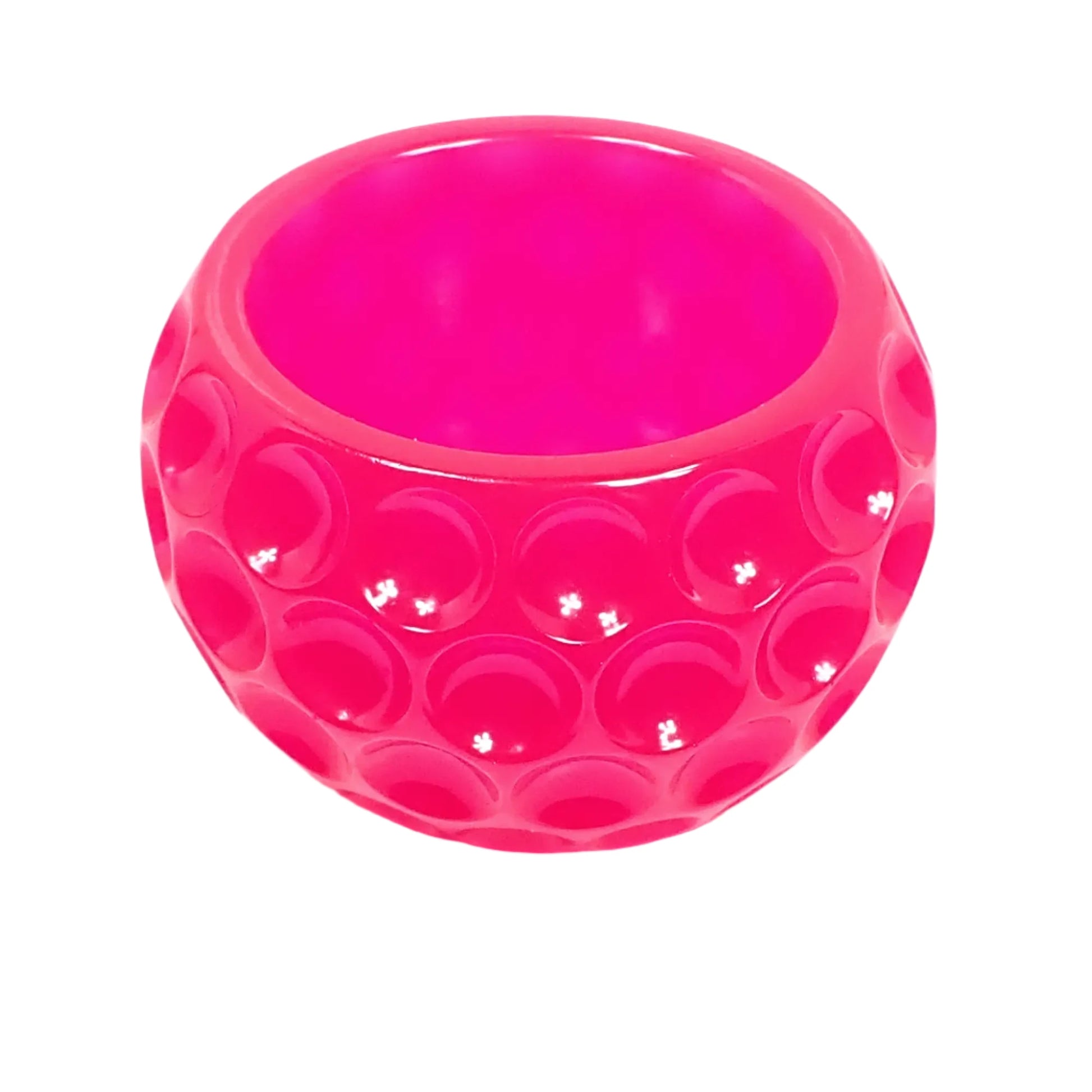 Angled top view of the neon pink dotted bowl showing the round opening at the top.