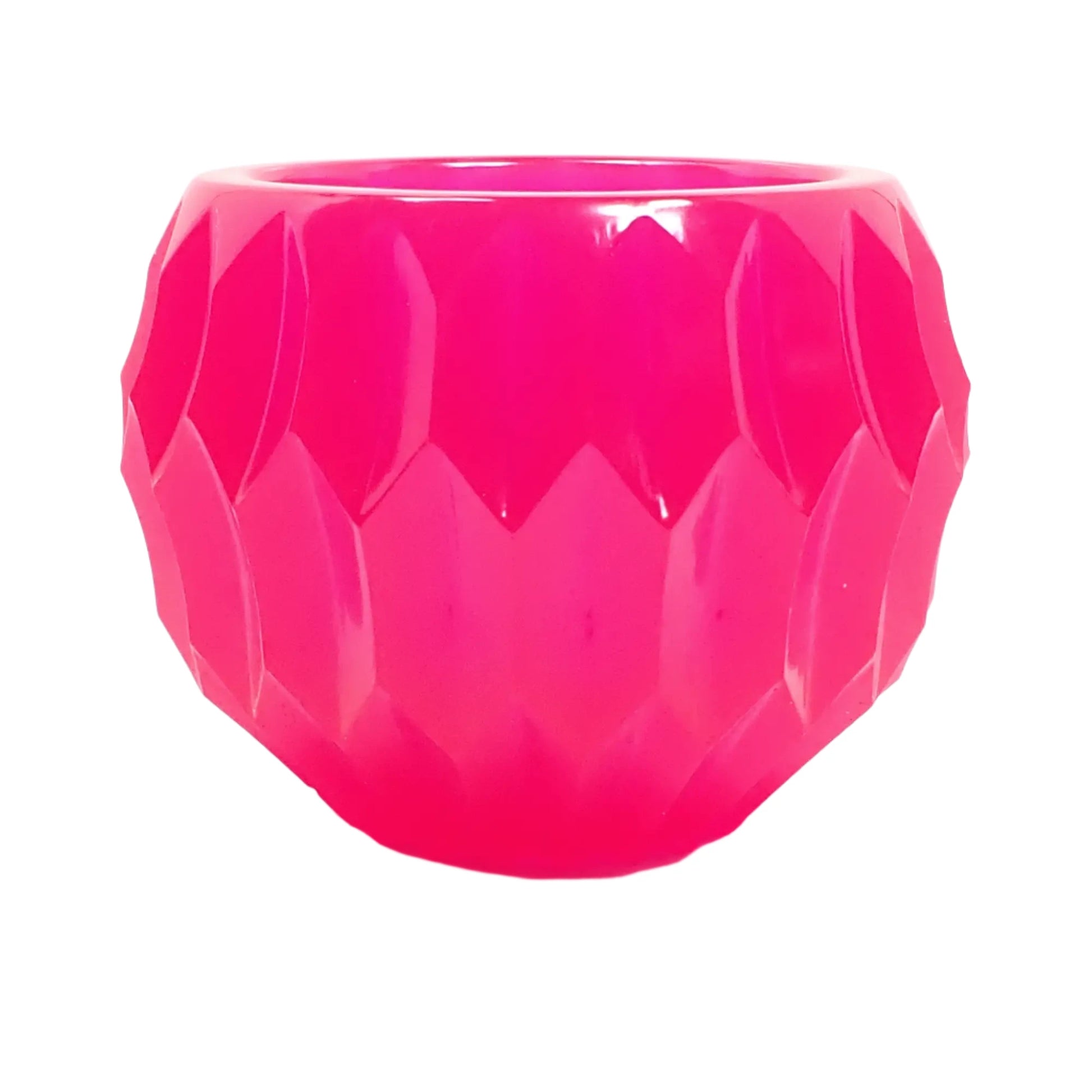 Side view of the handmade neon pink resin bowl showing more of the indented hexagon patter that goes all the way around it.