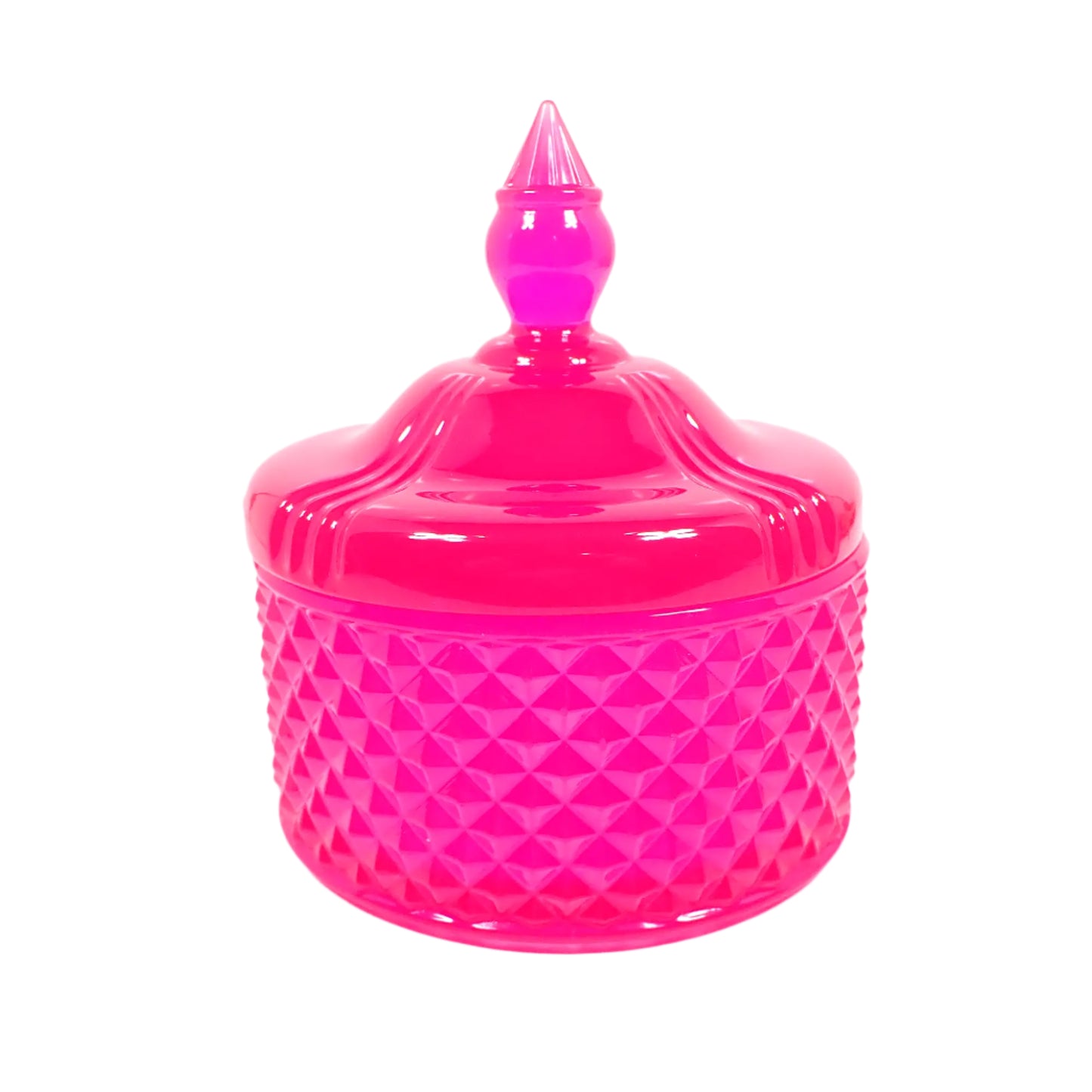 Side view of the handmade neon pink resin trinket box. It as a vintage style design with a faceted round bottom and smooth round top with a tapered knob to remove the lid with. The resin is shiny and semi translucent in a bright neon pink color. Would also be great as a candy dish for wrapped candies. 
