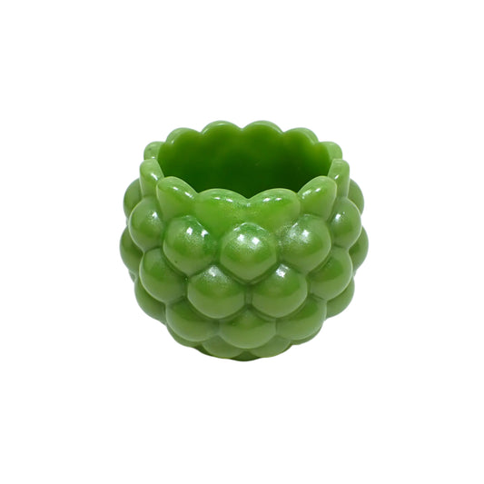 Another angled side view of the handmade olive green resin decorative bowl. The resin is shiny and opaque in an olive green color with a light pearly sheen.